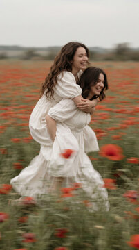oyful 35mm Film Photo of Friends Doing Piggyback in Poppy Field