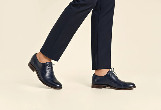 Dark navy shoes pair with tailored trousers