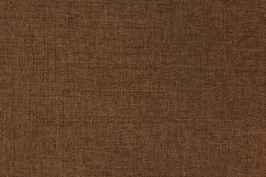 Dark brown linen fabric cloth texture background, seamless pattern of natural textile.