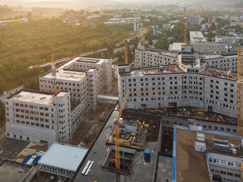 Aerial view of the construction site of the new F. D. Roosevelt University Hospital featuring multiple cranes and concrete structures in Banska Bystrica, Banskobystricky kraj, Slovakia.