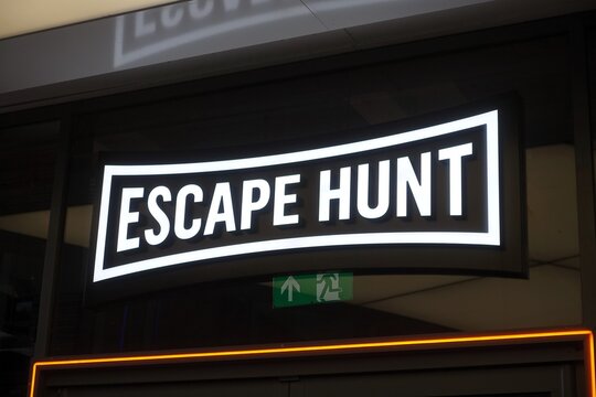 An illuminated sign for Escape Hunt, a global franchise specialising in themed escape room experiences, indoor puzzle games, and outdoor city treasure hunts