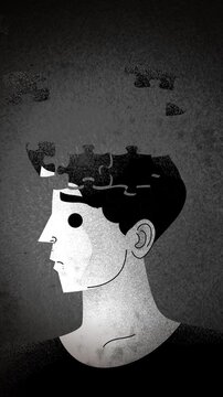 man whose head is formed from interlocking jigsaw puzzle pieces
