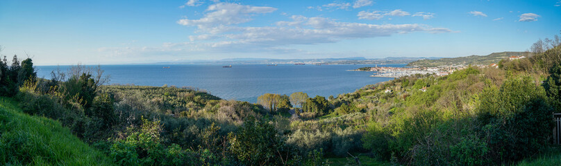 Fototapeta premium Panoramic view of Izola and the Adriatic Sea from the surrounding hills on a beautiful sunny day, Slovenia