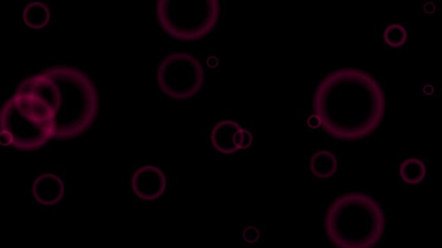 Glowing magenta circles float and loop continuously against a dark background.