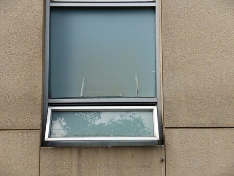 old window with shutters and wall