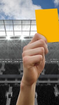 Animation of referee holding yellow card on pitch in sports stadium