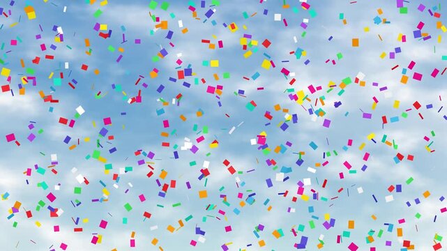 Colorful Confetti Falling Against a Bright Blue Cloudy Sky Background