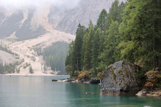 Lake Prags in autumn mist, South Tyrol, Italy