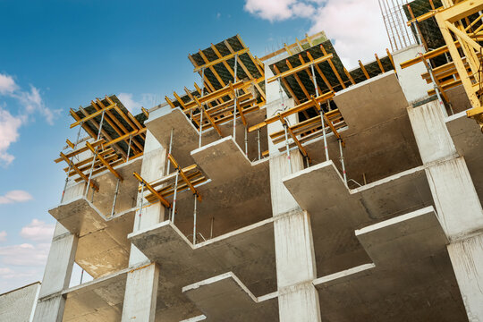 Reinforced concrete modern building under construction with formwork and exposed reinforcement