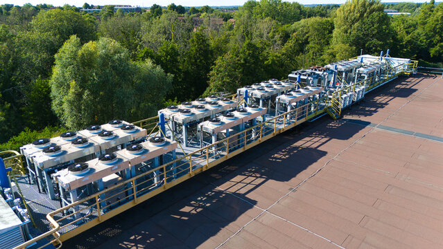 Aerial view of data center HVAC thermal management and cooling fans installed on a rooftop with industrial ventilation units in Andover, England, United Kingdom.