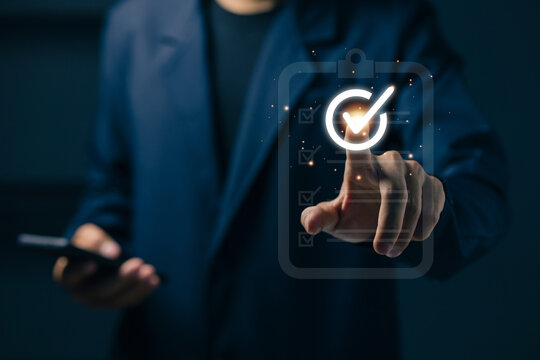 Businesswoman completing digital checklist on virtual interface, task management, business workflow, project planning, productivity improvement and online organization technology.