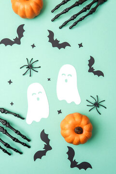 Halloween festive pattern with pumpkins, ghosts, bats, spiders, and skeleton hands.