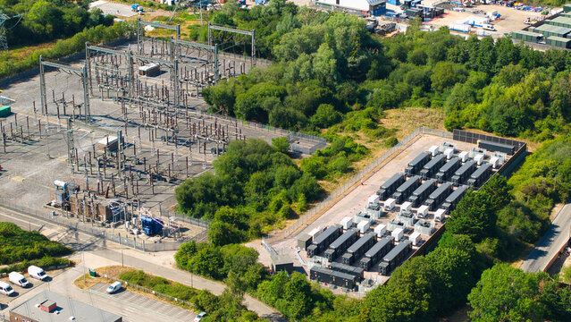 Aerial view of Nursling Substation 400kV and Battery Energy Storage Systems with rows of battery containers and electrical infrastructure in Nursling, England, United Kingdom.