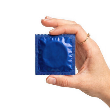 Closeup of a hand holding a blue condom wrapper isolated on transparent background