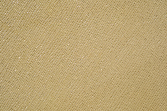 Pale yellow textured material background
