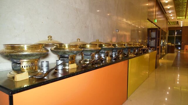 Buffet food warmers in a luxury hotel. Catering chafing dishes at a restaurant in Mumbai, India.
