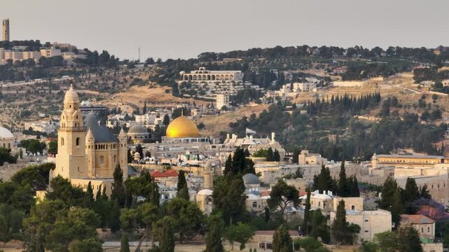 Telephoto view of the Jerusalem cityscape showcasing Mount Zion Hagia Maria Sion Abbey and Temple Mount golden dome at sunset.
