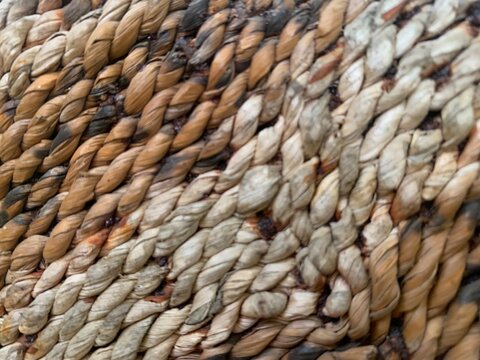 Close up texture of traditional hand woven natural rattan or seagrass basket