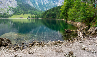 Obraz premium Scenic View of an Alpine Pasture with a Mountain Lake in the Berchtesgaden Alps, Bavaria, Germany