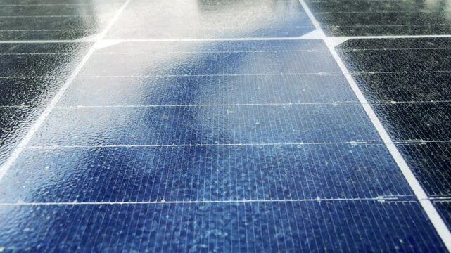 Sunlight Reflecting Across Blue Photovoltaic Solar Panel