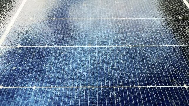 Detail of Solar Panel Cells with Moving Light Reflection