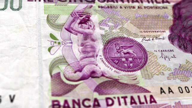 Close up macro view of fifty thousand Italian lira banknote observing front and reverse side with tracking motion in 4K Ultra HD footage
