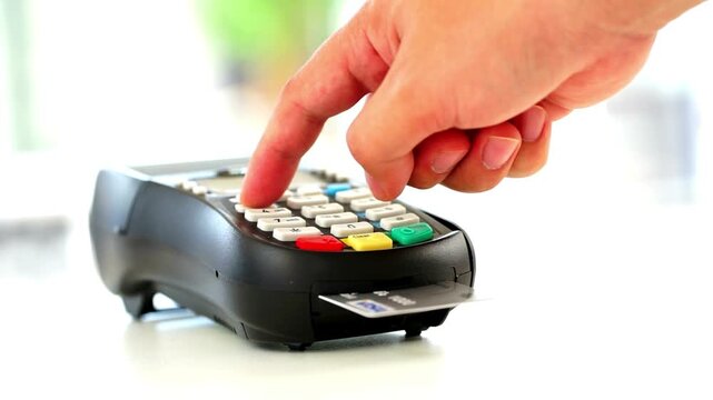 Credit card payment on modern terminal for retail store purchase to buy and sell shopping products and consumer services in 4K Ultra HD footage
