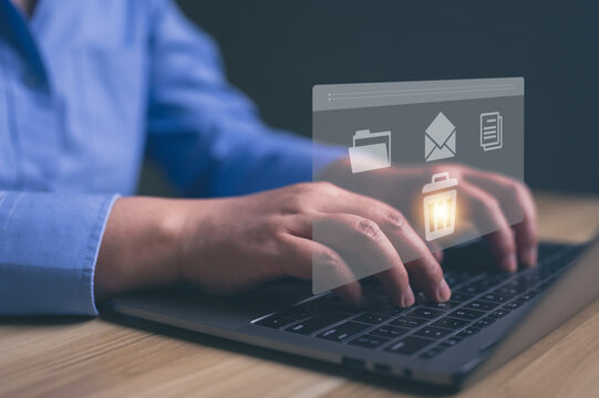 Businessman managing digital data and deleting unnecessary files on laptop with virtual interface. concept of digital cleanup, document management system (DMS), data privacy.