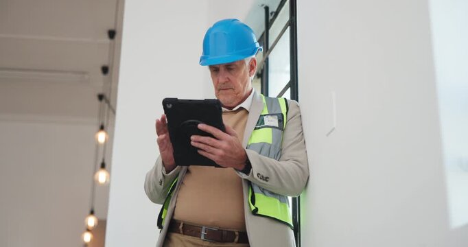 Maintenance, man and building inspection with tablet for code compliance, progress and reporting. Interior design, mature person and site visit with tech for quality control, renovation or low angle