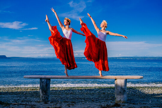 Two female dancers balance featuring a white model