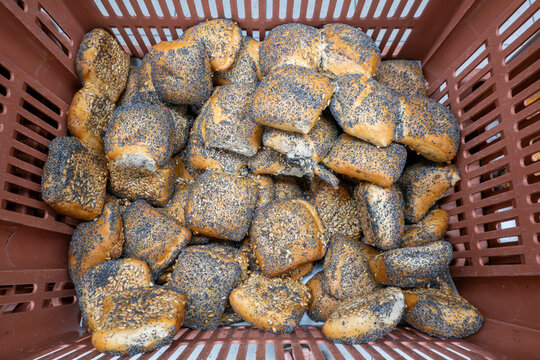 Hirtshals, Denmark A basket of fresh poppy seed buns in a supermarket.