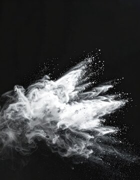A dynamic burst of white powder explodes against a dark background.