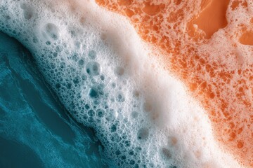 Fototapeta premium Close-up abstract of turquoise and orange hues with foamy bubbles
