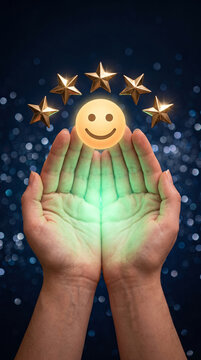 Cupped hands hold a glowing smiley face and gold stars, symbolizing excellent rating and positive feedback on a bokeh background