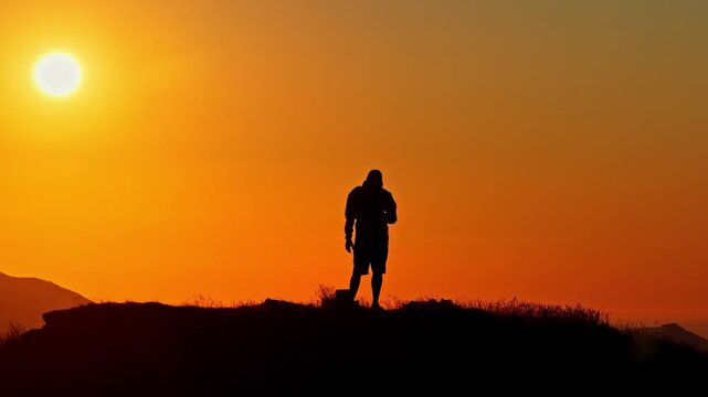 Aerial Back View of Drone Pilot Flying at Golden Hour Sunset Silhouette on Col d'Aubisque, French Pyrenees
