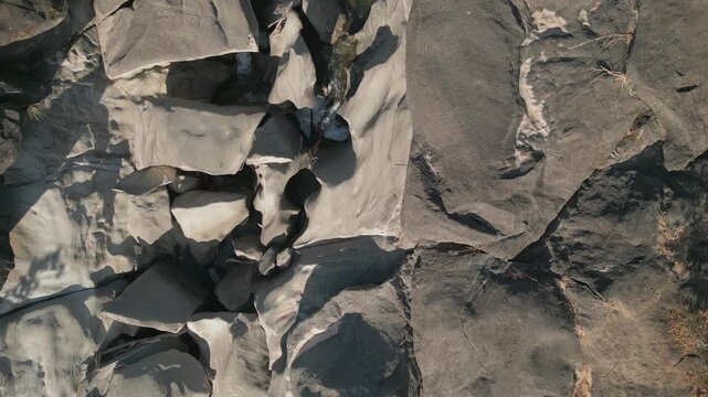 Sculpted quartzite bedrock of the Sao Miguel River at Vale da Lua, Chapada dos Veadeiros National Park, Alto Paraiso de Goias, Goias, Brazil, reveals polished rock slabs, erosion channels and fluvial