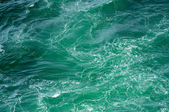Overhead view of a swirling Naruto whirlpool captured from Uzuno-michi walkway.