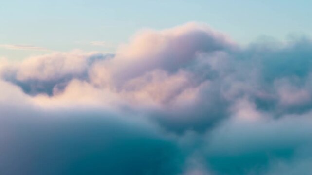 A Serene View of Soft, Fluffy Clouds Bathed in Gentle Light, Enhancing the Tranquility of the Sky and Creating a Dreamlike Atmosphere from Above