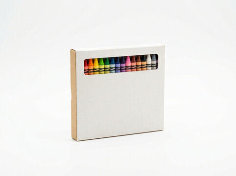 Box of multicolored crayons with a rectangular viewing window isolated on white background