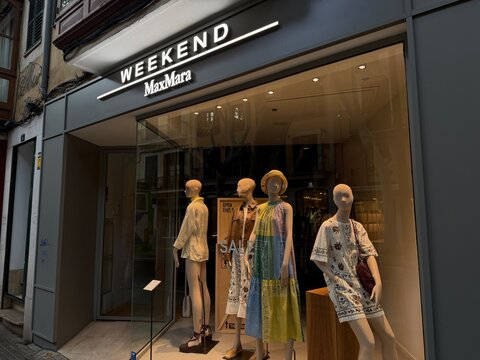 Mallorca, spain, july 25, 2026, weekend max mara storefront showcasing mannequins in summer apparel for a window display and retail fashion