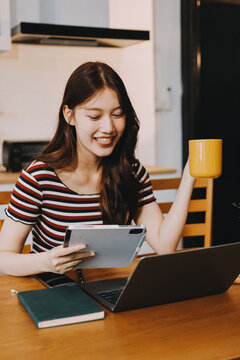 Asian woman using computer remote for business studying, watching online virtual webinar training meeting, video call. asian business woman talking on laptop in home office. Banner, copy space