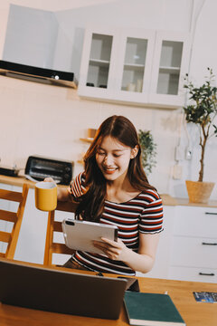 Asian woman using computer remote for business studying, watching online virtual webinar training meeting, video call. asian business woman talking on laptop in home office. Banner, copy space