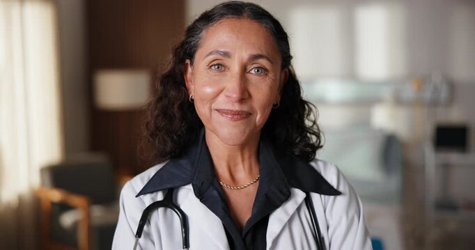 Face, doctor and woman in clinic with smile, knowledge and experience for healthcare management. Happy, mature person and manager in hospital with medical expertise, positive attitude and wellness.