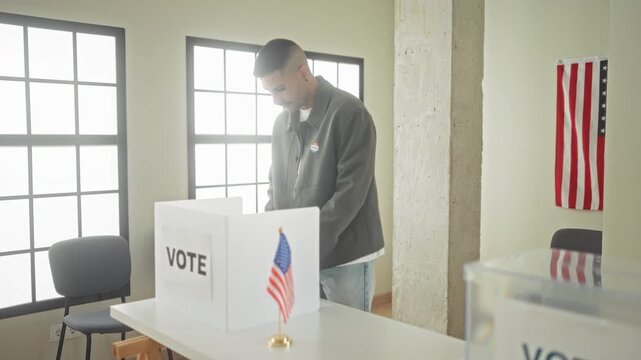Man places ballot into clear ballot box at a polling table beside an american flag and every vote counts sign inside a building; civic responsibility.