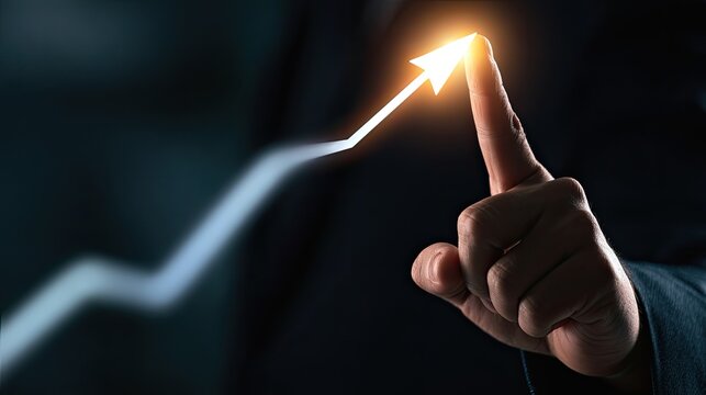 A finger points to a glowing arrow on a rising graph