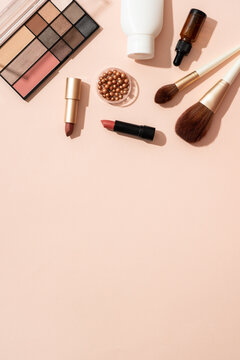 Make up products. Shadow palette with brushes, lipstick, cream and others.