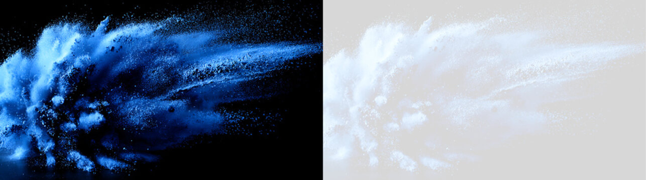Vibrant blue powder explosion isolated on dark background. Dynamic blue dust splash and particle burst visual effect