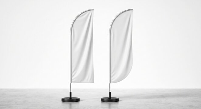 Front view mockup featuring two blank white feather flags on metallic poles over a concrete floor in a bright studio background.