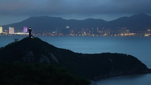 Seascape and ctyscape views of Putuo Mountains during blue hour