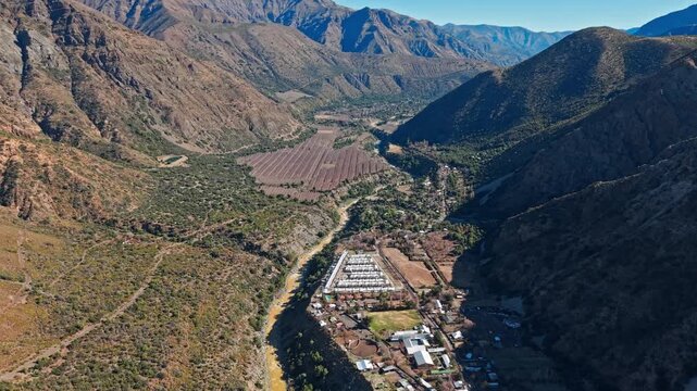 Sunny day in Cajon del Maipo. Aerial flying over San Gabriel, Chile